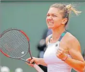  ?? AP ?? Romania's Simona Halep celebrates her fourthroun­d win against Spain's Carla Suarez Navarro on Monday.