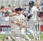  ?? - AFP ?? England's Ben Stokes (L) celebrates with James Anderson after taking the wicket of India's Virat Kohli lbw (leg before wicket) for 51 during play on the fourth day of the first Test at Edgbaston in Birmingham