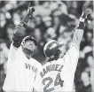  ??  ?? Boston’s David Ortiz and Manny Ramirez celebrate Ortiz’ two-run home run in the first inning in Game 7 of the ALCS against the New York Yankees propelling the Red Sox to become the first baseball team to ever come back from an 0-3 playoff series deficit and win, 14 years ago today.