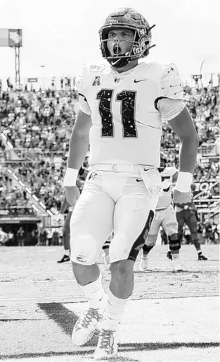  ?? WILLIE J. ALLEN JR./AP ?? Central Florida quarterbac­k Dillon Gabriel (11) celebrates after scoring against Houstont last season.