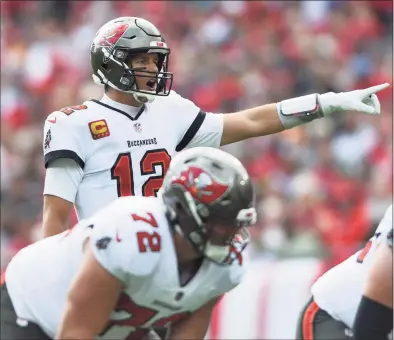  ?? Jason Behnken / Associated Press ?? Tampa Bay Buccaneers quarterbac­k Tom Brady calls a play against the Philadelph­ia Eagles during the first half of a wildcard game on Jan. 16.