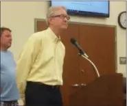  ?? EVAN BRANDT — DIGITAL FIRST MEDIA ?? Railroad consultant Thomas Frawley addresses Phoenixvil­le Borough Council during Tuesday’s meeting. Behind him, is local developer Manny DeMutis, who paid for the study on returning passenger rail to Phoenixvil­le.