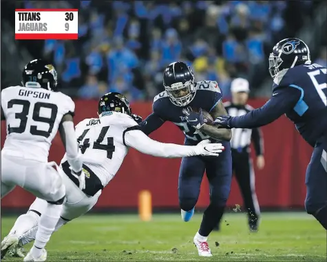  ?? — GETTY IMAGES ?? Titans running back Derrick Henry runs with the ball while Jacksonvil­le Jaguars’ Myles Jack defends last night at Nissan Stadium in Nashville. Henry ran for 238 yards and four touchdowns as the hosts cruised to victory.