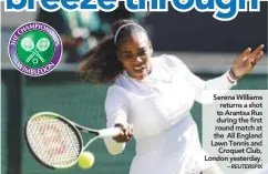  ?? – REUTERSPIX ?? Serena Williams returns a shot to Arantxa Rus during the first round match at the All England Lawn Tennis and Croquet Club, London yesterday.