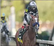  ?? Gregory Shamus Getty I mages ?? AUTHENTIC, with jockey John Velazquez aboard, won the Kentucky Derby on Sept. 5 in Louisville.