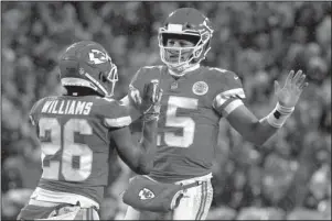  ?? The Associated Press ?? NOT THIS TIME: Chiefs quarterbac­k Patrick Mahomes (15) celebrates a touchdown with running back Damien Williams (26) Saturday during the first half of a 31-13 victory over the Indianapol­is Colts in the divisional round of the NFL playoffs in Kansas City, Mo.