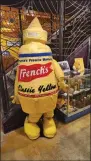 ?? BILL RETTEW/MEDIANEWS GROUP ?? Who wouldn’t want to dress up as a mustard bottle at the National Mustard Museum in Madison, Wisconsin?