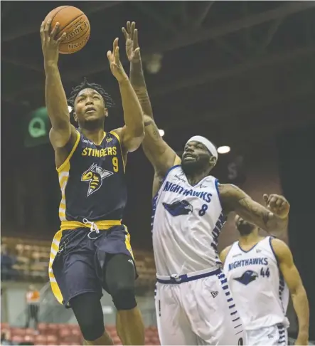  ?? Shaughn Butts ?? Mathieu Kamba of the Stingers drives to the basket but misses the layup after beating Chadrack Lufile of the Guelph Nighthawks on Friday night at the Edmonton Expo Centre.