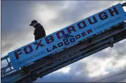  ?? GRETCHEN ERTL/THE NEW YORK TIMES ?? A Foxborough Fire Department ladder truck, detailed with the New England Patriots logo. Foxborough(or Foxboro) has been the home of the Patriots since 1971.