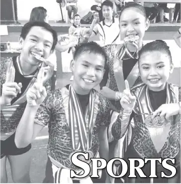  ?? PHOTO FROM TUMBLE TIME GYMNASTICS CENTER ?? Nopsscea gymnasts James Vincent Arroyo, Justine Cababan, Michaela Manaloto, and Amanda Rosco show the medals they won in the 2017 Palarong Panlalawig­an in Negros Occidental.