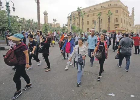  ?? EPA ?? Tourists at a market in Cairo. Egypt recorded a 60 per cent increase in Chinese tourists last year