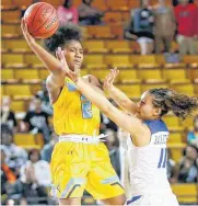  ??  ?? Putnam City West’s Ce’Nara Skanes passes over Choctaw’s Aliyah Llanusa during a Class 6A state semifinal Friday at Mabee Center in Tulsa.