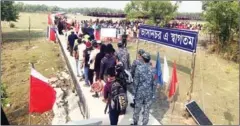  ?? AFP ?? Rohingya refugees stand in a queue after they disembarke­d from a Bangladesh Navy ship to the island of Bashar Char in Noakhali on Friday.