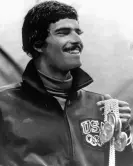  ?? Photograph: Anonymous/AP ?? American swimmer Mark Spitz holds five of the seven gold medals he won at the 1972 Olympics.