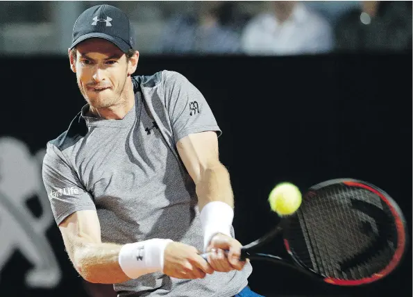  ?? — THE ASSOCIATED PRESS ?? Britain’s Andy Murray returns the ball during his stunning loss to Italy’s Fabio Fognini at the Italian Open in Rome.