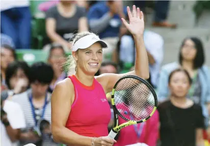  ??  ?? Caroline Wozniacki of Denmark celebrates after defeating Garbine Muguruza of Spain during their semi-final match of the Pan Pacific Open