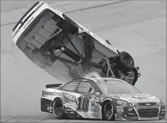  ?? GREG MCWILLIAMS/AP PHOTO ?? Matt Kenseth flips after Danica Patrick crashes into him during Sunday’s NASCAR race in Talladega, Ala.