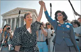  ?? J. SCOTT APPLEWHITE/AP ?? Norma McCorvey, left, aka Jane Roe in 1973’s Roe v. Wade, and attorney Gloria Allred hold hands at the U.S. Supreme Court in 1989 after listening to arguments in an abortion case.