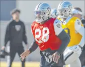  ?? Heidi Fang Las Vegas Review-journal ?? Running back Josh Jacobs practices Thursday with a splint on his right hand. The team’s captains recently added Jacobs to the leadership group.