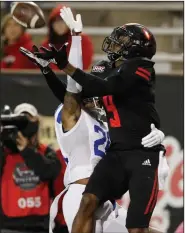  ?? (Arkansas Democrat-Gazette/Thomas Metthe) ?? Wide receiver Jonathan Adams Jr. makes the catch on a 42-yard touchdown for Arkansas State while being defended by Georgia State’s Quavian White. The Red Wolves had eight touchdown passes during the victory.