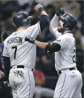  ?? Chris O'Meara Associated Press ?? THE RAYS’ Steven Souza, right, celebrates his two-run home run in the second inning with teammate Logan Morrison. Souza also homered in the seventh.