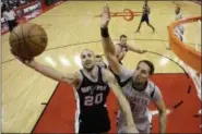  ?? ERIC CHRISTIAN SMITH — ASSOCIATED PRESS ?? San Antonio’s Manu Ginobili shoots as Rockets forward Ryan Anderson defends during the first half in Game 4 May 7 in Houston.