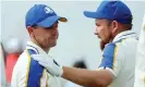  ?? Photograph: Warren Little/Getty Images ?? Shane Lowry commiserat­es with Rory McIlroy after the pain of Ryder Cup defeat at Whistling Straits.