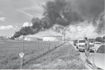  ?? Guiseppe Barranco / Beaumont Enterprise ?? Smoke and fire rise from a heavy oil tank at Valero’s Port Arthur Refinery on Tuesday. The facility had returned to almost 50 percent capacity after shutting down for Hurricane Harvey. No injuries or health issues were reported, officials said, after...