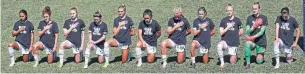  ?? RICK BOWMER THE ASSOCIATED PRESS ?? Portland Thorns players kneel during the U.S. national anthem before their match Saturday.