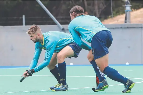  ?? Picture: LUKE BOWDEN ?? HOPING: Tasmanian Josh Beltz, left, elected to stay at the Kookaburra training centre in Perth through the coronaviru­s lockdown.