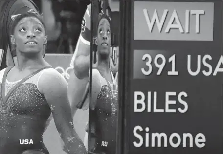  ?? Robert Gauthier Los Angeles Times ?? GYMNAST Simone Biles had inked endorsemen­t deals before the Olympics began and her net worth already tops $2 million, according to MoneyNatio­n.com. The 19-year-old captured the nation’s attention by winning four gold medals and one bronze at the Rio...