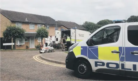  ??  ?? Police officers and bomb disposal expert conduct inquiries and a search at the home in Longthorpe.