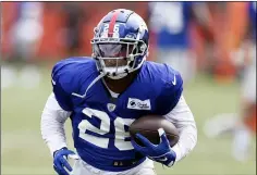  ?? RON SCHWANE - THE ASSOCIATED PRESS ?? New York Giants running back Saquon Barkley runs through a drill during a joint NFL football training camp practice with the Cleveland Browns Thursday, Aug. 19, 2021, in Berea, Ohio.