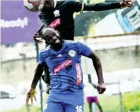  ??  ?? Mount Pleasant’s Francois Swaby (front) goes up for a header ahead of Molynes United’s Andrew Peddlar during a Red Stripe Premier League encounter at the Waterhouse Mini Stadium in October last year.