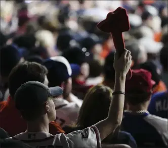  ?? ASHLEY LANDIS / AP ?? An Atlanta Braves fan does the chop cheer during the sixth inning in Game 2 of the World Series against the Houston Astros on Wednesday.