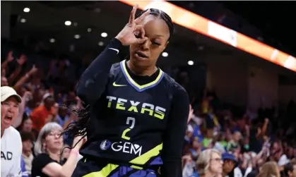  ?? ?? Dallas Wings guard Odyssey Sims reacts after making a three-point shot against the Atlanta Dream. Photograph: Michael Ainsworth/AP