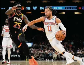  ?? Matt York/Associated Press ?? Knicks guard Jalen Brunson hit all nine of his 3-point attempts on Friday night in a 50-point performanc­e to lead New York past the Suns in Phoenix.