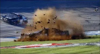  ??  ?? Jamie McMurray slides through the infield during the 1000Bulbs.com 500 NASCAR Cup Series race at Talladega Sunday.