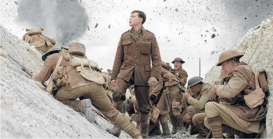  ?? UNIVERSAL PICTURES ?? George MacKay, center, stars in “1917” from director Sam Mendes (“Skyfall,” “American Beauty”).