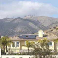  ??  ?? A residentia­l home with solar panels in Porter Ranch, California, on Jan 15, 2016. — WPBloomber­g photo