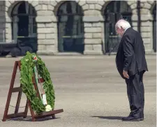  ??  ?? President Higgins lays a wreath at Collins Barracks in honour of Ireland’s fallen. Photos: Tony Gavin