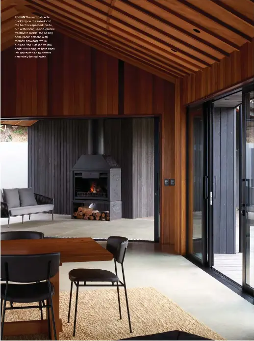  ??  ?? LIVING The vertical cedar cladding on the exterior of the bach is repeated inside, but with a tongue-and-groove treatment. Inside, the ceiling pairs cedar battens with Meranti plywood, while outside, the Alaskan yellow cedar roof shingles have been left untreated so rainwater can safely be collected.