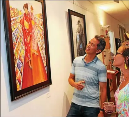  ??  ?? Patrons and visitors viewed the art work of area artist Maia Palmer during her Friends Gallery opening June 15 at the Darlington Arts Center. The center held an Honors Music Recital in conjunctio­n with the gallery opening featuring Palmer’s work. This...