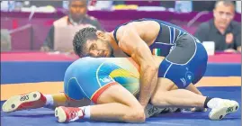  ?? BURHAAN KINU/HT ?? ■
Jitender (right) in action against Daniyar Kaisanov in New Delhi on Sunday.