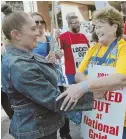  ??  ?? RALLYING: Local 12003 boss Joe Kirylo, left, speaks outside the Prudential Center yesterday. Striking hotel worker Blanca Mejia, above left, with National Grid worker Marie McGinley.