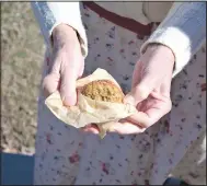  ?? (NWA Democrat-Gazette/Daniel Bereznicki) ?? Students were encouraged to pack a lunch with items that were available during the 1920s, such as glass jars, wicker baskets and wax paper. One student’s parent baked oatmeal sandwich cookies.