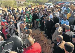  ?? Pictures: SUPPLIED ?? HOME SOIL: Dawid Stuurman’s remains laid to rest at the Sarah Baartman Heritage Centre in Hankey yesterday. Right, carrying the box of remains as they arrive back in SA, from left, Trevor Kopeledi, Luciano Kopeledi and Joseph Kreeling of the East...