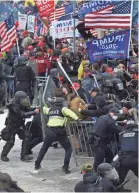  ?? ROBERTO SCHMIDT/AFP VIA GETTY IMAGES ?? Trump supporters clash with overwhelme­d police and security forces at the Capitol on Jan. 6.