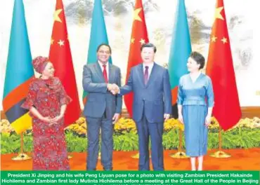  ?? On Friday. HUANG JINGWEN/XINHUA ?? President Xi Jinping and his wife Peng Liyuan pose for a photo with visiting Zambian President Hakainde Hichilema and Zambian first lady Mutinta Hichilema before a meeting at the Great Hall of the People in Beijing