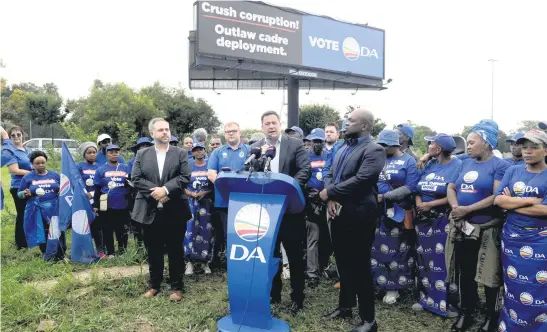  ?? Picture: Neil McCartney ?? FIGHTING ON. DA leader John Steenhuise­n speaks as the DA unveils a billboard on the N12 in Bedfordvie­w yesterday as part of their escalation of the battle against the ANC’s cadre deployment policy.